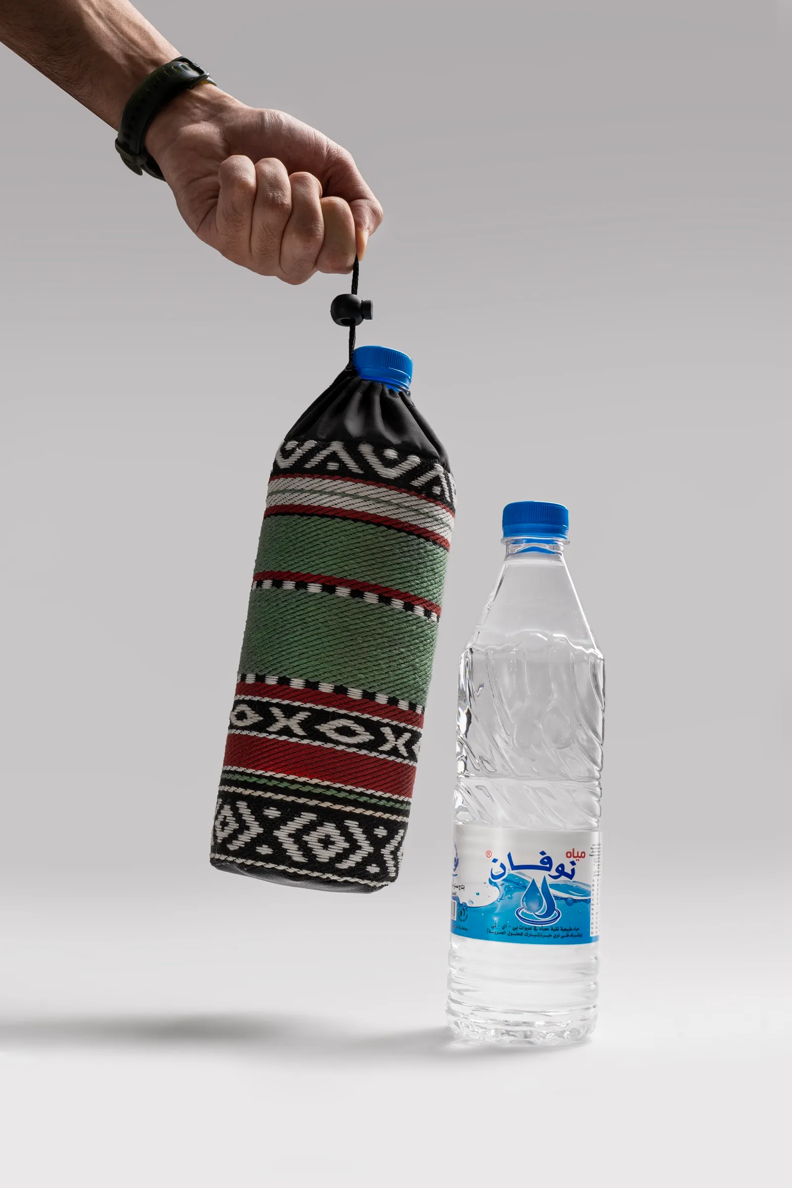 A custom woven sleeve dressing a Novan bottle